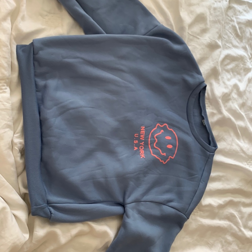 Graphic drop shoulder pullover. Blue and pink.